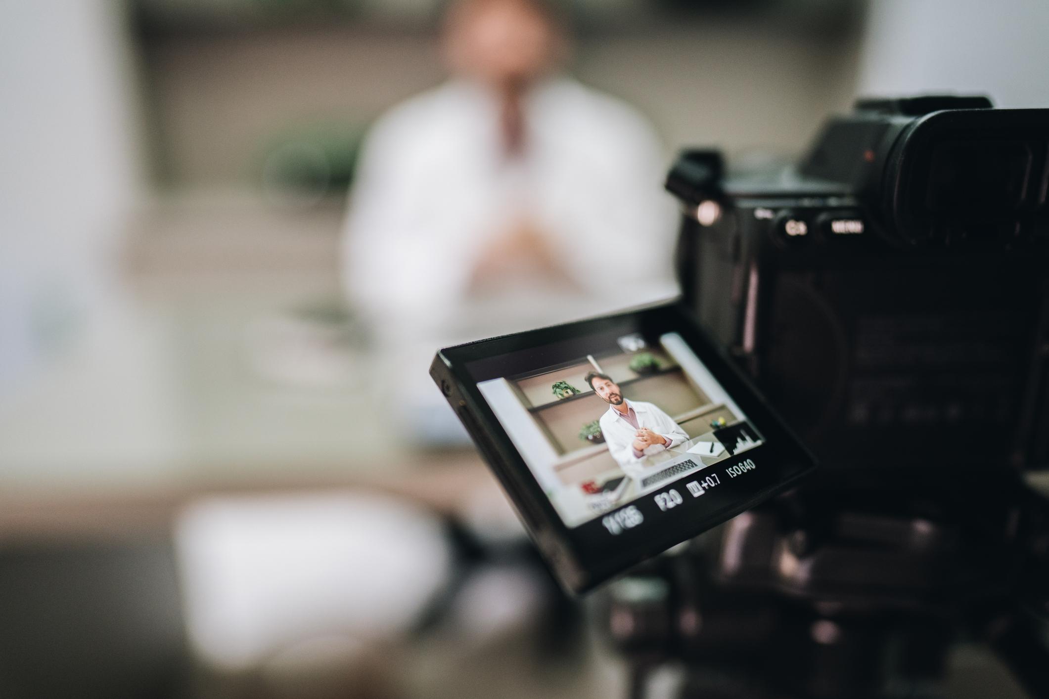 Close-up of a digital camera filming an interview