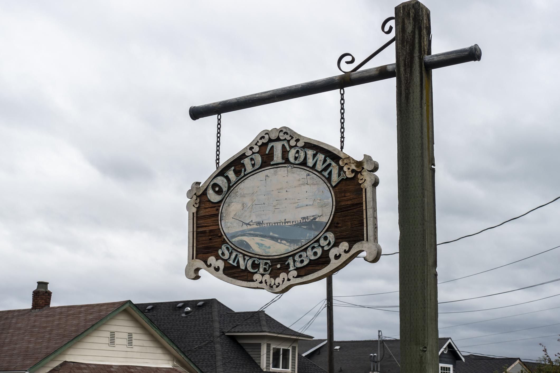 Street view of the Old Town Tacoma sign on an cloudy, overcast day