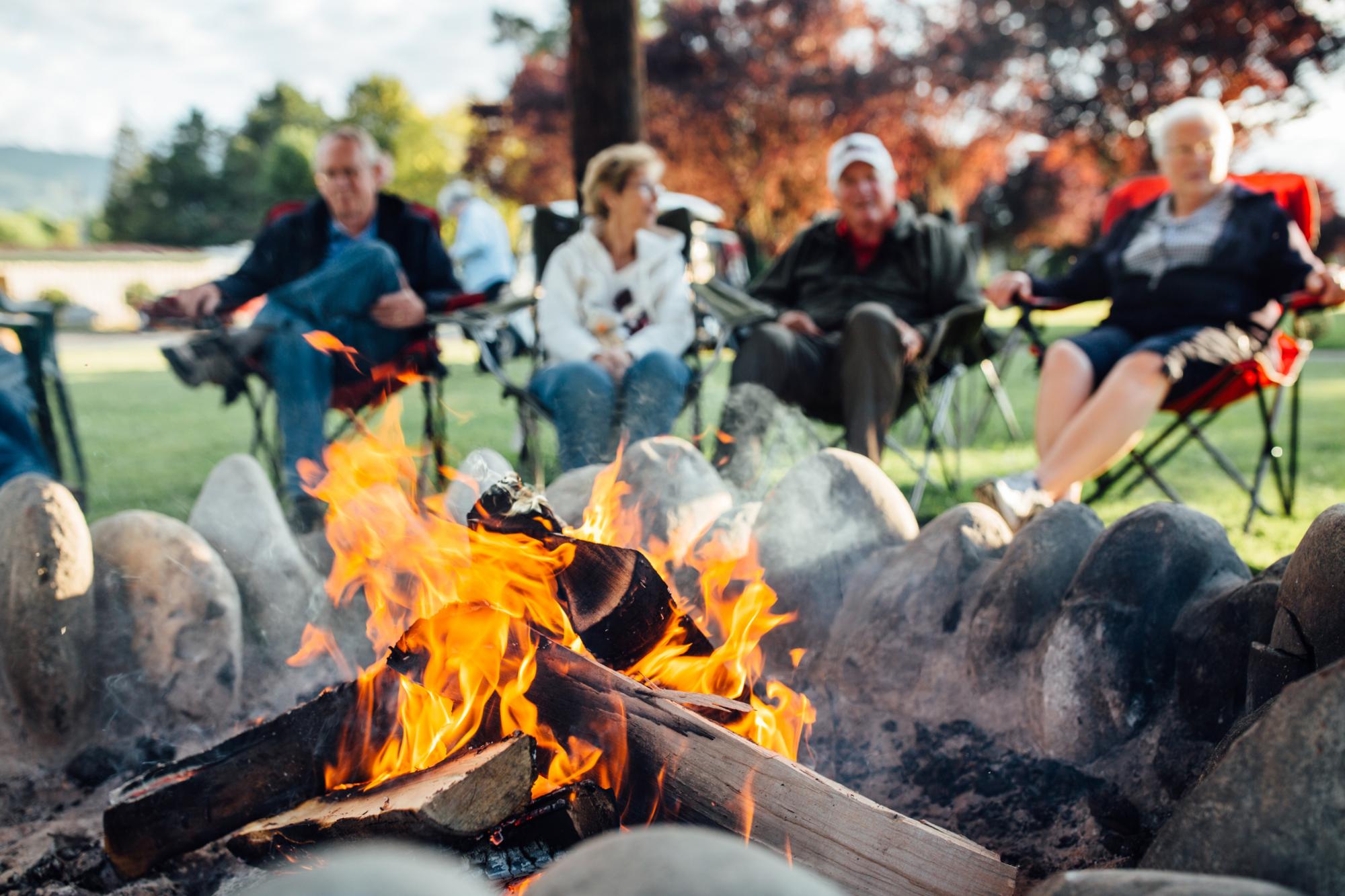 People sitting around a campfire