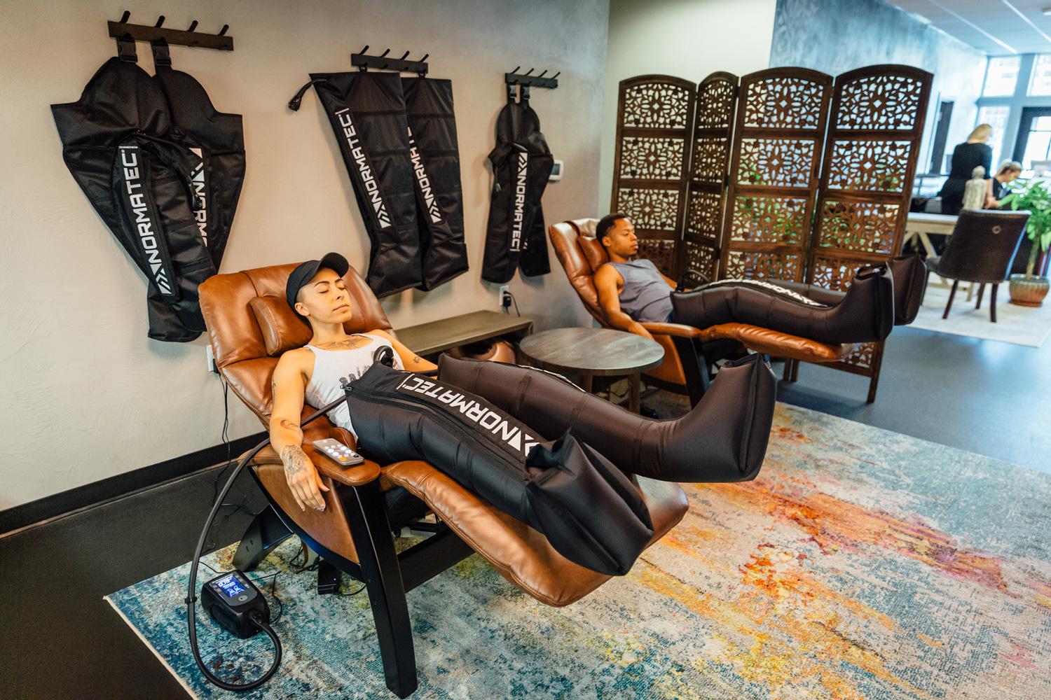 Athletes using Normatec compression therapy